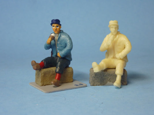 Man seated on Straw Bail with Ice Cream (FIG-2501)