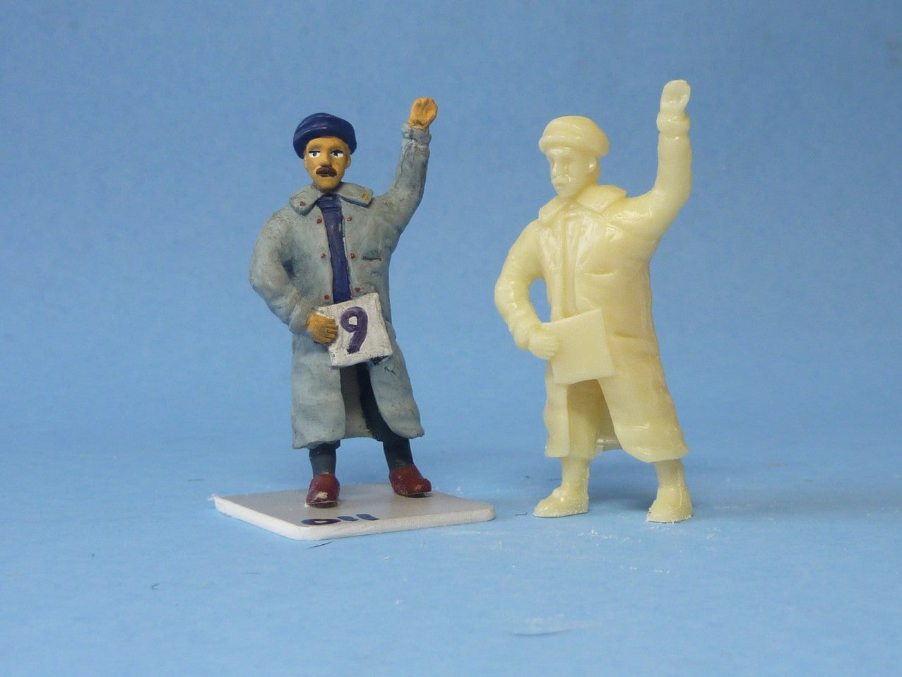 Man with Number Card and Arm Raised (FIG-1201)
